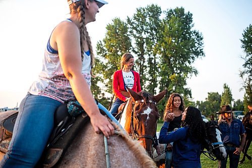 MIKAELA MACKENZIE / FREE PRESS

	
Alyssa Selman hangs out with her sister (Amy Scott, left) and daughter (Ari Selman, right) before competing at the Denim &amp; Dust Barrel Racing Series in Carman on Tuesday, Aug. 13, 2024.

For Mike McIntyre story.