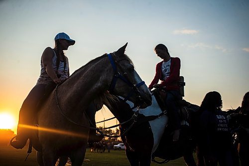 MIKAELA MACKENZIE / FREE PRESS

	
Sisters Amy Scott (left) and Alyssa Selman wait on their horses before Alyssa competes at the Denim &amp; Dust Barrel Racing Series in Carman on Tuesday, Aug. 13, 2024.

For Mike McIntyre story.