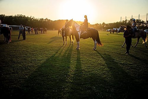 MIKAELA MACKENZIE / FREE PRESS

	
Alyssa Selman (centre) watches the open races before she competes at the Denim &amp; Dust Barrel Racing Series in Carman on Tuesday, Aug. 13, 2024.

For Mike McIntyre story.