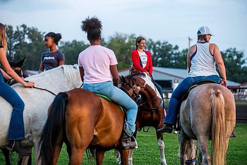 MIKAELA MACKENZIE / FREE PRESS

	
Alyssa Selman hangs out with the girls that she rides with and mentors after competing at the Denim &amp; Dust Barrel Racing Series in Carman on Tuesday, Aug. 13, 2024.

For Mike McIntyre story.