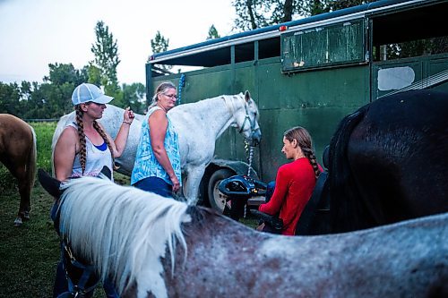 MIKAELA MACKENZIE / FREE PRESS

	
Amy Scott (left) Alyssa Selman (right) decide which horses will be loaded into each trailer after the Denim &amp; Dust Barrel Racing Series in Carman on Tuesday, Aug. 13, 2024.

For Mike McIntyre story.