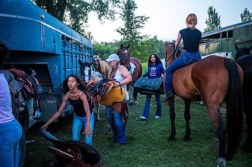 MIKAELA MACKENZIE / FREE PRESS

	
Tack gets loaded back in to the truck after the Denim &amp; Dust Barrel Racing Series in Carman on Tuesday, Aug. 13, 2024.

For Mike McIntyre story.