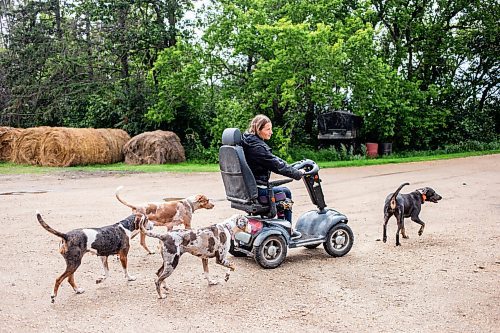 MIKAELA MACKENZIE / FREE PRESS

	
Alyssa Selman and her dogs on her property near Graysville on Thursday, Aug. 8, 2024.

For Mike McIntyre story.