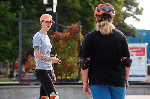 14082024
Jesi Wood with Recovery Skateshop offers advice and encouragement to 12-year-old Airianna Nicholson of Brandon during a week-long beginners skate camp put on by Recovery Skateshop at the Kristopher Campbell Memorial Skate Plaza in downtown Brandon on Wednesday morning. Recovery is running a similar camp for intermediate skateboarders next week. The recent Paris Olympics featured both men&#x2019;s and women&#x2019;s skateboarding events for the second time in Olympic history. (Tim Smith/The Brandon Sun)