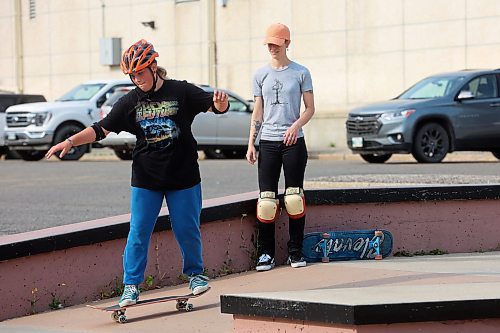 14082024
Jesi Wood (R) with Recovery Skateshop offers advice and encouragement to 12-year-old Airianna Nicholson of Brandon during a week-long beginners skate camp put on by Recovery Skateshop at the Kristopher Campbell Memorial Skate Plaza in downtown Brandon on Wednesday morning. Recovery is running a similar camp for intermediate skateboarders next week. The recent Paris Olympics featured both men&#x2019;s and women&#x2019;s skateboarding events for the second time in Olympic history. (Tim Smith/The Brandon Sun)