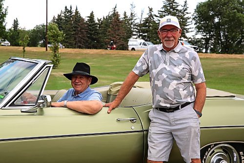 Dick Martinook is in the driver's seat with his younger brother Bill standing beside their 1968 Chevrolet Impala convertible that was once owned by their older brother Don, who bought the car new but passed away in 1991. (Photos by Michele McDougall/The Brandon Sun)