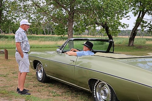 Dick Martinook is in the driver's seat with his younger brother Bill standing beside their 1968 Chevrolet Impala convertible that was once owned by their late older brother Don, who bought the car new, but passed away in 1991. (Michele McDougall/The Brandon Sun)