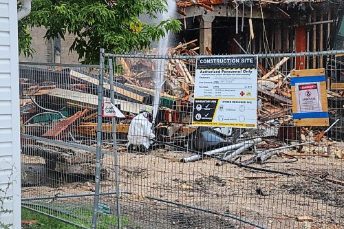 Tyler Searle / Free Press
Contractors were on site at 579 McDermot Ave. Thursday, where work was underway to complete a demolition of the crumbling warehouse. Workers were required to spray the building with water during the demolition, due to the possible presence of asbestos.