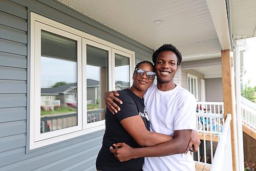 Anita Onifade and her son, Ben, are the new residents of an affordable home on Franklin Street in Brandon. She became the official owner of the home with a key ceremony on Thursday, thanks to Habitat for Humanity. (Connor McDowell/Brandon Sun)