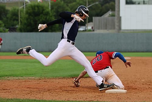 RFNOW Cardinals base runner Paycen Warkentin steps on the bag safely as the ball falls out of the glove of Westman Fire Protection Cubs first baseman George McNeil (20) as he tried to scoop up a one-hopper during Game 3 of the Andrew Agencies Senior AA Baseball League final on Thursday at Andrews Field. (Perry Bergson/The Brandon Sun)