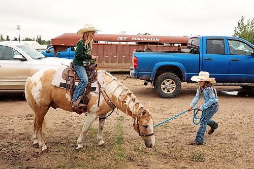 Dally Brown (right) leads friend Finley Ross atop horse Bandit while the two girls enjoy the first day of the Virden Indoor High School Rodeo at Tundra Oil and Gas Place in Virden on Thursday as part of the Virden Indoor Rodeo and Wild West Daze. Events continue all weekend in Virden, including the first go round of the Virden Indoor Rodeo tonight. (Tim Smith/The Brandon Sun)