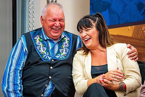 NIC ADAM / FREE PRESS
David Chartrand (left), President of the MMF, jokes with Bernadette Smith, Minister of housing addictions and homelessness, at the announcement of the re-opening of Yoga Public Thursday afternoon.
240815 - Thursday, August 15, 2024.

Reporter: Gabby Piche