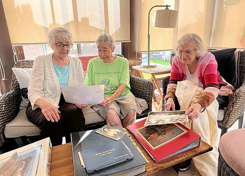 Joy Stusek (from left), Rose Evans, and Zenny Burton - retired nurses, look at old photos and newspaper clippings from their nursing school days at Brandon General Hospital. They met 72 years ago when they were 18 years old and have always kept in touch. The three recently got together in Brandon for a two-day reunion. (Michele McDougall/The Brandon Sun)