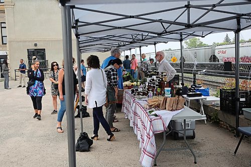 Some patrons and vendors at the Downtown Summer Market held at WIS office on Pacific Ave. on Friday. (Abiola Odutola/The Brandon Sun