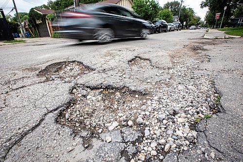 MIKAELA MACKENZIE / WINNIPEG FREE PRESS
	
A pothole on Westminster Avenue on Friday, Aug. 16, 2024. 

For Joyanne story.
Winnipeg Free Press 2024