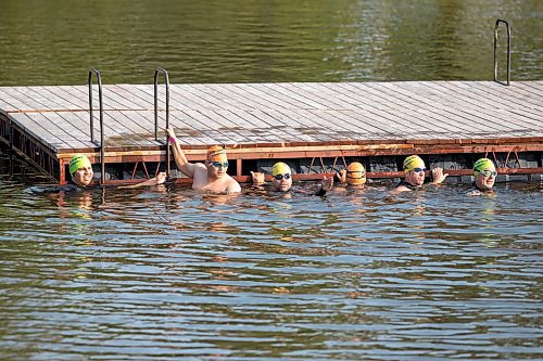 BROOK JONES / FREE PRESS
Jonathan Courchene (third from far left), who is a First Nations triathlete, gives last minute instructions to 15-year-old Phoenix Abraham (second from far left) and 17-year-old Brad Courchene (far left) before they start the swim portion of the Free Spirit Sprint Triathlon in Pinawa, Man., Sunday, Aug. 11, 2024. Courchene has been coaching both youth in the sport of triathlon.