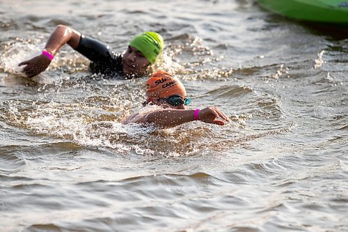 BROOK JONES / FREE PRESS
Fifteen-year-old Phoenix Abraham (right) and 17-year-old Brad Courchene (left), who are both from Sagkeeng First Nation, compete in the swim portion of the Free Spirit Sprint Triathlon in Pinawa, Man., Sunday, Aug. 11, 2024.