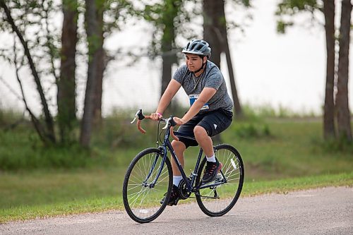 BROOK JONES / FREE PRESS
Phoenix Abraham, 15, who is from Sagkeeng First Nation, competes in the bike portion of the Free Spirit Sprint Triathlon in Pinawa, Man., Sunday, Aug. 11, 2024.