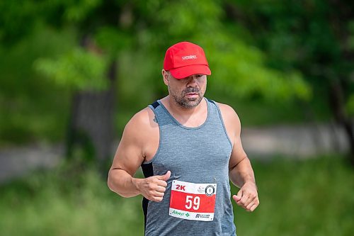 BROOK JONES / FREE PRESS
Jonathan Courchene, who is a First Nations triathlete, competes in the run portion of the Free Spirit Sprint Triathlon in Pinawa, Man., Sunday, Aug. 11, 2024.