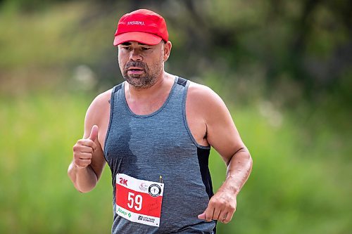 BROOK JONES / FREE PRESS
Jonathan Courchene, who is a First Nations triathlete, competes in the run portion of the Free Spirit Sprint Triathlon in Pinawa, Man., Sunday, Aug. 11, 2024.