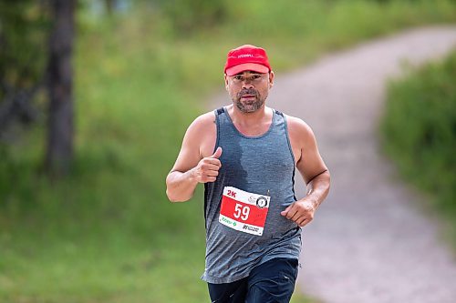 BROOK JONES / FREE PRESS
Jonathan Courchene, who is a First Nations triathlete, competes in the run portion of the Free Spirit Sprint Triathlon in Pinawa, Man., Sunday, Aug. 11, 2024.