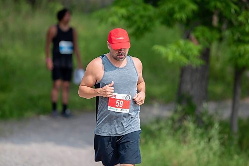 BROOK JONES / FREE PRESS
Jonathan Courchene, who is a First Nations triathlete, competes in the run portion of the Free Spirit Sprint Triathlon in Pinawa, Man., Sunday, Aug. 11, 2024.