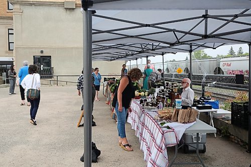 Some patrons and vendors at the Downtown Summer Market held at WIS office on Pacific Ave. on Friday. (Abiola Odutola/The Brandon Sun