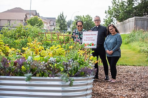 MIKAELA MACKENZIE / WINNIPEG FREE PRESS
	
Parishioner Rod Cantiveros (left), father Darrin Gurr, and garden coordinator Rachel Banmann at the new community garden at St. Gianna Beretta Molla Roman Catholic Church on Friday, Aug. 16, 2024. The church is using the space to grow food to give to Villa Rosa and Missionaries of Charity, who give it away to needy recipients in the city.

For John Longhurst story.
Winnipeg Free Press 2024