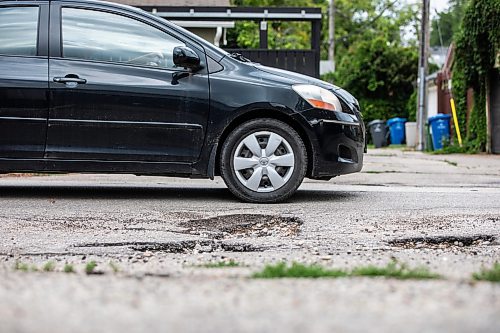 MIKAELA MACKENZIE / WINNIPEG FREE PRESS
	
A pothole on Westminster Avenue on Friday, Aug. 16, 2024. 

For Joyanne story.
Winnipeg Free Press 2024