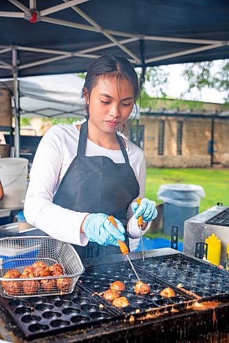 NIC ADAM / FREE PRESS
Keith Robles, of Ems Lan Bistro, makes Takoyaki for customers at Winnipeg&#x2019;s Streat Feast Festival at the Forks Friday afternoon.
240816 - Friday, August 16, 2024.

Reporter: ?