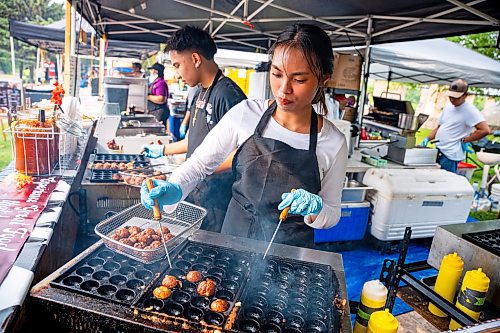 NIC ADAM / FREE PRESS
Keith Robles, of Ems Lan Bistro, makes Takoyaki for customers at Winnipeg&#x2019;s Streat Feast Festival at the Forks Friday afternoon.
240816 - Friday, August 16, 2024.

Reporter: ?