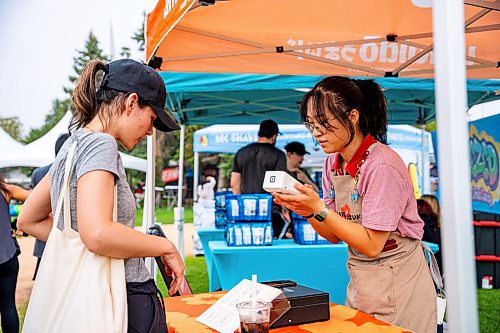 NIC ADAM / FREE PRESS
Yang Liong, of Umaido, takes customers&#x2019; orders at Winnipeg&#x2019;s Streat Feast Festival at the Forks Friday afternoon. 
240816 - Friday, August 16, 2024.

Reporter: ?