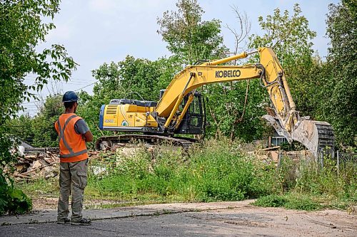 Mike Sudoma/Free Press
A worker watches as an excavator cleans up the debris left after a house in the 600 block of Stella avenue was demolished following a Friday evening fire in the home
August 17, 2024
