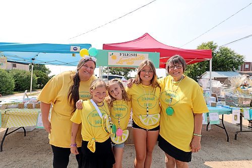 Jenna Desilets, Etta Puppe, Éire Brennan, Aria Elliott and Marguerite Lapka-Woytowich were back outside Rivers' Westoba Credit Union branch on Saturday to sell lemonade with the proceeds going to CancerCare Manitoba one year after their first fundraiser. (Colin Slark/The Brandon Sun)