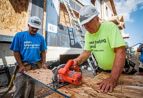 JOHN WOODS / FREE PRESS
Jerry Storie, right, volunteer leader at Habitat For Humanity, is photographed with Michel Roy on a building site on Pandora Ave W Tuesday, August 13, 2024. Storie is a retired educator and former MLA.

Reporter: ken