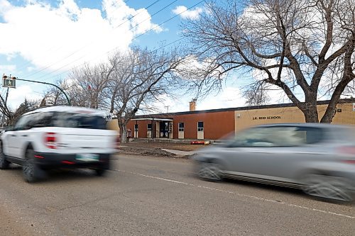 Cars drive by J.R. Reid School on 26th Street earlier this year. Brandon City Council will hear the results of public feedback on the planned redevelopment of the street at a special council meeting tonight. (Colin Slark/The Brandon Sun)