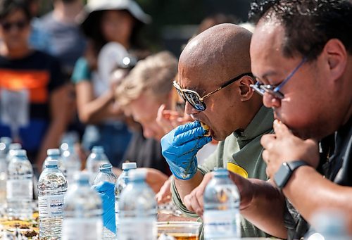 JOHN WOODS / WINNIPEG FREE PRESS
The Feast Beast competes by eating 30 tacos at the Birria Battle Eating Competion during Streat Feast at the Forks in Winnipeg Sunday, August 18, 2024.

Re: ?