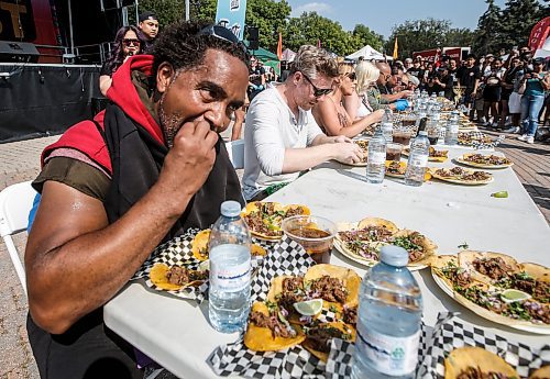 JOHN WOODS / WINNIPEG FREE PRESS
Dino Corriette competes by eating 30 tacos at the Birria Battle Eating Competion during Streat Feast at the Forks in Winnipeg Sunday, August 18, 2024.

Re: ?