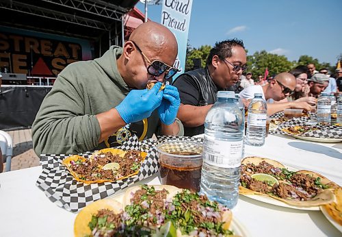 JOHN WOODS / WINNIPEG FREE PRESS
The Feast Beast competes by eating 30 tacos at the Birria Battle Eating Competion during Streat Feast at the Forks in Winnipeg Sunday, August 18, 2024.

Re: ?