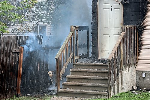 The worst of the damage caused by a house fire on the 200 block of First Street on Sunday afternoon was to the north and rear of the building. Police are investigating whether the blaze was caused by squatters setting a campfire next to the fence. (Colin Slark/The Brandon Sun)