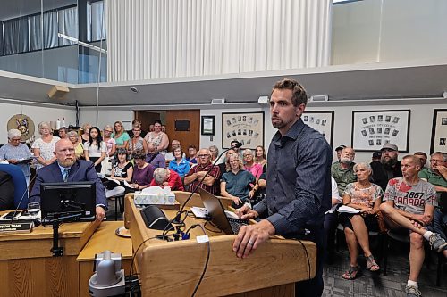 Brandon's director of planning, Ryan Nickel, gives a presentation at the beginning of a public hearing on the new city plan in front of a capacity crowd during Monday's Brandon City Council meeting. (Colin Slark/The Brandon Sun)