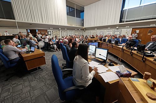 The crowd for a public hearing at Monday's Brandon City Council meeting was so large that all the seats in chambers were filled, a overflow room was full and others stood where they could find room. (Colin Slark/The Brandon Sun)