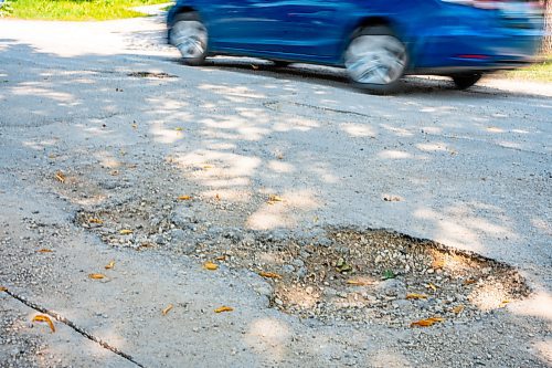 NIC ADAM / FREE PRESS
After a long wait, pothole repairs finally commence along Augusta Dr. Monday.
240819 - Monday, August 19, 2024.

Reporter:?