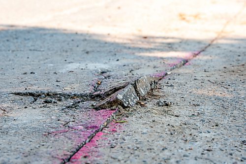 NIC ADAM / FREE PRESS
After a long wait, pothole repairs finally commence along Augusta Dr. Monday.
240819 - Monday, August 19, 2024.

Reporter:?