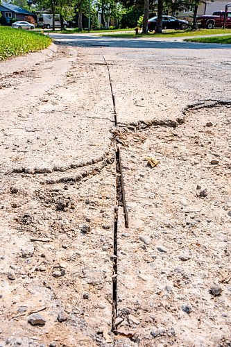 NIC ADAM / FREE PRESS
After a long wait, pothole repairs finally commence along Augusta Dr. Monday.
240819 - Monday, August 19, 2024.

Reporter:?