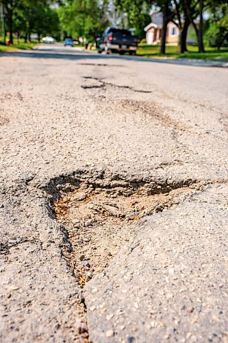 NIC ADAM / FREE PRESS
After a long wait, pothole repairs finally commence along Augusta Dr. Monday.
240819 - Monday, August 19, 2024.

Reporter:?