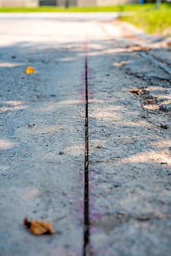 NIC ADAM / FREE PRESS
After a long wait, pothole repairs finally commence along Augusta Dr. Monday.
240819 - Monday, August 19, 2024.

Reporter:?