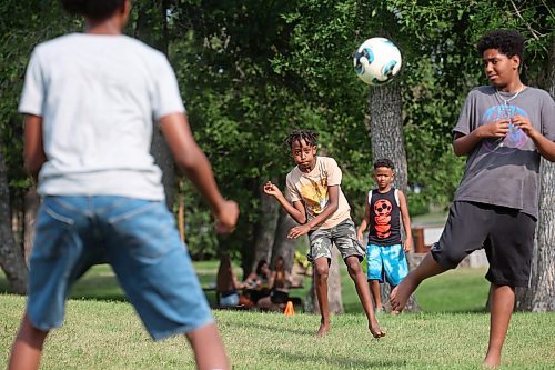 19082024
Merken Zerilasie (C) kicks the ball for a goal while playing soccer with friends at Rideau Park on a sunny Monday afternoon. (Tim Smith/The Brandon Sun)