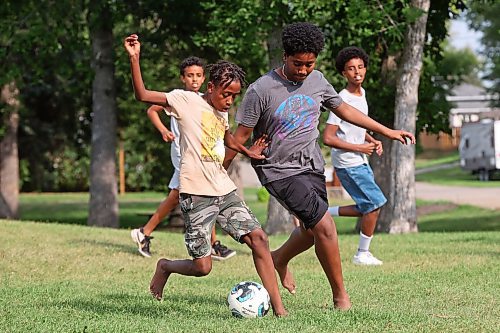 19082024
Merken Zerilasie and Geremi Tesfu battle for the ball while playing soccer with friends at Rideau Park on a sunny Monday afternoon. (Tim Smith/The Brandon Sun)