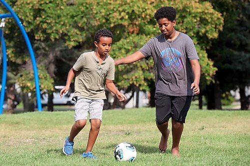 19082024
Milki Eshetu and Geremi Tesfu play soccer with friends at Rideau Park on a sunny Monday afternoon. (Tim Smith/The Brandon Sun)